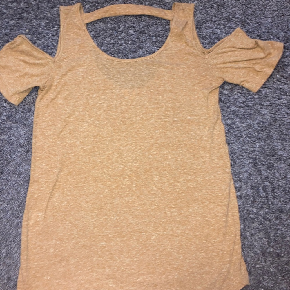 Gold ish, yellowish, t-shirt over your shoulders